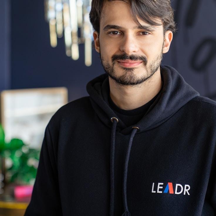 Asha Rao, Lead Design Curator at Trivero Luminary, reviewing corporate floral arrangements